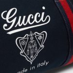 gucci-large-printed-canvas-duffle-bag.jpg